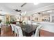 Dining room showcasing elegant table with views into living area and kitchen at 23219 N 145Th Dr, Sun City West, AZ 85375