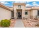 Inviting home exterior with desert landscaping and covered entry to welcome visitors at 23219 N 145Th Dr, Sun City West, AZ 85375