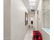 Hallway with tile floors, recessed lighting, and a view to a bathroom for added functionality at 23219 N 145Th Dr, Sun City West, AZ 85375