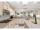 Kitchen features countertops, gas range, and flows into dining area at 23219 N 145Th Dr, Sun City West, AZ 85375