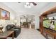 Inviting living room with tile flooring, large windows, and classic furnishings at 23219 N 145Th Dr, Sun City West, AZ 85375