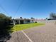 Spacious backyard with gravel, block fencing, and grassy area perfect for outdoor activities at 2450 E Clarendon Ave, Phoenix, AZ 85016