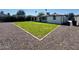 Lovely backyard with ample space and gravel, accented by lush green grass at 2450 E Clarendon Ave, Phoenix, AZ 85016