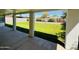 Covered patio provides shade, overlooking a spacious grassy backyard with ample room for recreation at 2450 E Clarendon Ave, Phoenix, AZ 85016