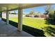 Relaxing covered patio overlooking the lush backyard, perfect for entertaining at 2450 E Clarendon Ave, Phoenix, AZ 85016