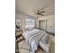 Inviting bedroom features natural light, ceiling fan, and a spacious closet at 2450 E Clarendon Ave, Phoenix, AZ 85016
