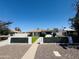 Well-maintained single-story home with desert landscaping and charming curb appeal at 2450 E Clarendon Ave, Phoenix, AZ 85016