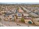 An elevated view of a residential neighborhood with well-maintained homes, streets, and desert landscaping at 25320 W Heathermoor Dr, Buckeye, AZ 85326