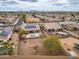 Community aerial view featuring solar, pool, covered patio, desert landscaping, and proximity to local amenities and roadways at 25320 W Heathermoor Dr, Buckeye, AZ 85326