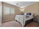 Neutral bedroom featuring cozy carpet, a window, and a neatly made bed at 25320 W Heathermoor Dr, Buckeye, AZ 85326