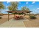 Community picnic area features covered seating, tables, and well-maintained landscaping for enjoyable outdoor gatherings at 25320 W Heathermoor Dr, Buckeye, AZ 85326