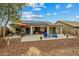 Covered patio features ample seating, a barbeque area, and offers a perfect spot for outdoor entertaining or relaxation at 25320 W Heathermoor Dr, Buckeye, AZ 85326