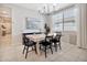 Modern dining room with a stylish light fixture, a wooden table, and seating for six at 25583 S 224Th Pl, Queen Creek, AZ 85142