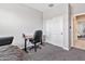 Minimalist office space with a desk, chair, and closet at 25583 S 224Th Pl, Queen Creek, AZ 85142