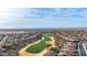 An aerial view of a community golf course with desert landscaping at 26716 W Ponderosa Ln, Buckeye, AZ 85396