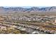 Aerial view of the neighborhood with mountain views and desert landscaping at 26716 W Ponderosa Ln, Buckeye, AZ 85396