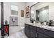 Modern bathroom boasts double sinks, granite counters and a glass-enclosed shower at 26716 W Ponderosa Ln, Buckeye, AZ 85396