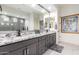 Modern bathroom featuring granite countertops, dual sinks, and sleek fixtures at 26716 W Ponderosa Ln, Buckeye, AZ 85396