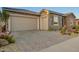 Well-maintained home with a large paver driveway and spacious three-car garage at 26716 W Ponderosa Ln, Buckeye, AZ 85396