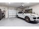 Clean and well-organized garage features epoxy floors and ample storage space at 26716 W Ponderosa Ln, Buckeye, AZ 85396