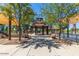 Picturesque gazebo and playground area with walkways, trees, and shaded seating at 26716 W Ponderosa Ln, Buckeye, AZ 85396