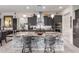 Modern kitchen featuring a large center island, sleek gray cabinets, and stainless-steel appliances at 26716 W Ponderosa Ln, Buckeye, AZ 85396