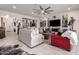 Bright living room with a ceiling fan, tile floor, recessed lights, and unique decorations at 26716 W Ponderosa Ln, Buckeye, AZ 85396