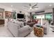 Spacious living room featuring recessed lighting, modern decor and seamless outdoor access at 26716 W Ponderosa Ln, Buckeye, AZ 85396