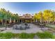 Elegant outdoor seating area with string lights, patio furniture, and views of the building at 26716 W Ponderosa Ln, Buckeye, AZ 85396