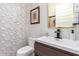 This powder room features designer tile and an elegant floating vanity and hardware at 26716 W Ponderosa Ln, Buckeye, AZ 85396