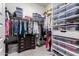 Well-organized walk-in closet with ample hanging space, shelving, and storage solutions at 26716 W Ponderosa Ln, Buckeye, AZ 85396