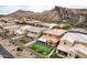 Neighborhood aerial view showcases houses with mountain views, and recreational backyard, perfect for Gathering living at 26868 N 104Th Ln, Peoria, AZ 85383