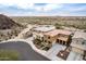 Aerial view of beautiful homes in a neighborhood with desert landscaping, with mountain views at 26868 N 104Th Ln, Peoria, AZ 85383