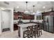 Well-equipped kitchen featuring a large island, stainless steel appliances, and granite countertops at 26868 N 104Th Ln, Peoria, AZ 85383