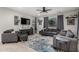 Comfortable living room featuring neutral paint and flooring, and a ceiling fan at 26868 N 104Th Ln, Peoria, AZ 85383