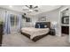 A main bedroom with a ceiling fan, a window and carpet flooring at 26868 N 104Th Ln, Peoria, AZ 85383