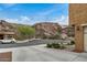 Street view showcasing the home's location near a scenic mountain with native landscaping at 26868 N 104Th Ln, Peoria, AZ 85383