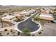 Aerial view of a quiet residential street with neatly arranged homes and serene desert landscapes, offering a peaceful living at 26868 N 104Th Ln, Peoria, AZ 85383