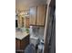 Classic bathroom featuring wood cabinets and standard fixtures at 306 S Recker Rd # 212, Mesa, AZ 85206