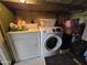 Functional laundry area with modern washer and dryer units for efficient chore management at 306 S Recker Rd # 212, Mesa, AZ 85206