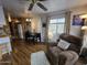 Cozy living room with dining area featuring comfortable seating and natural light at 306 S Recker Rd # 212, Mesa, AZ 85206