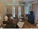 Cozy living room featuring a ceiling fan, recliner, and soft, neutral-toned curtains at 306 S Recker Rd # 212, Mesa, AZ 85206