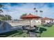 Outdoor community recreation area with tables, seating, and shade at 306 S Recker Rd # 212, Mesa, AZ 85206