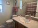 Well-maintained bathroom featuring vanity, toilet, and decorative accents at 3301 S Goldfield Rd # 4025, Apache Junction, AZ 85119