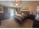 Large primary bedroom with ensuite bathroom and backyard access at 3301 S Goldfield Rd # 4025, Apache Junction, AZ 85119