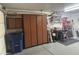 Garage with storage cabinets, a work bench, and assorted tools at 3301 S Goldfield Rd # 4025, Apache Junction, AZ 85119