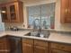 Close up of kitchen sink and window area, neutral counter tops at 3301 S Goldfield Rd # 4025, Apache Junction, AZ 85119