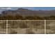 Expansive desert and mountain views from a property with a white fence in the foreground at 3301 S Goldfield Rd # 4025, Apache Junction, AZ 85119