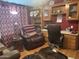 Home office with cozy seating, desk, cabinets, and western themed decor at 3301 S Goldfield Rd # 4025, Apache Junction, AZ 85119