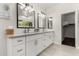 Bathroom featuring double sinks, modern lighting, and neutral color palette at 3431 E Canary Ct, Chandler, AZ 85286